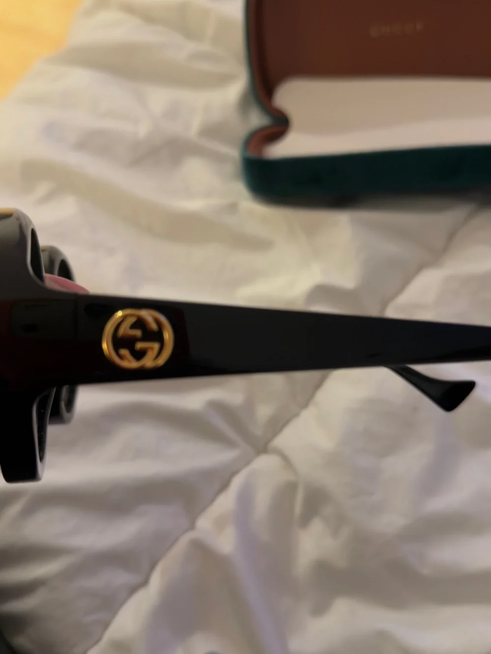 Gucci Black Round Sunglasses with Gold Logo Accent